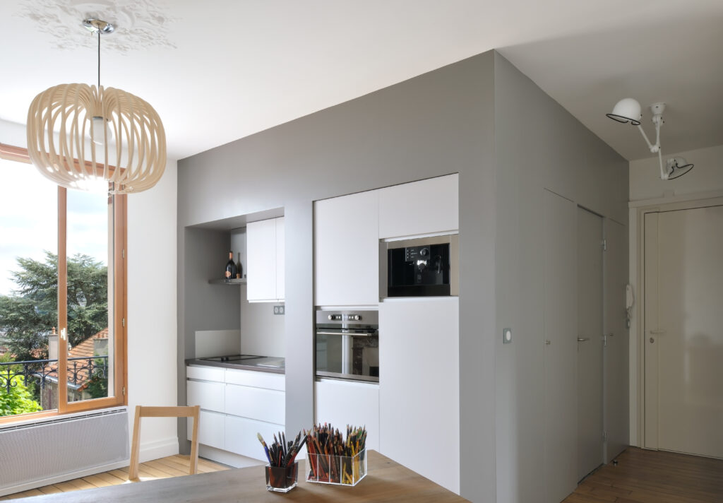 Modern kitchen block in a redone one bedroom apartment in Meudon, near Paris
